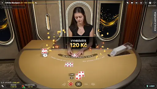 Live Infinite Blackjack – krupiérka rozdává karty, hráč vyhrává 120 Kč, limity sázek 20 až 100 000 Kč